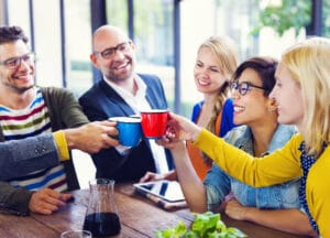 Group of multi-ethnical people celebrating their new start-up business.